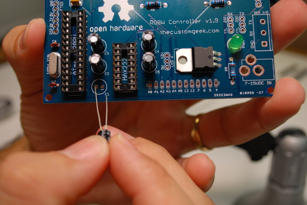Installing the last electrolytic cap. :)