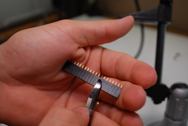 Trimming the pin extension header.
